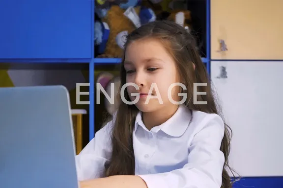 Student at laptop with the word Engage across the image